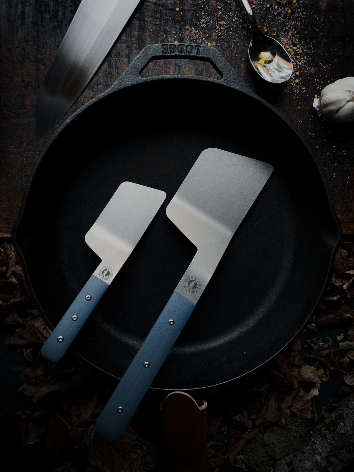 a right handed blue handled set of spatulas 
